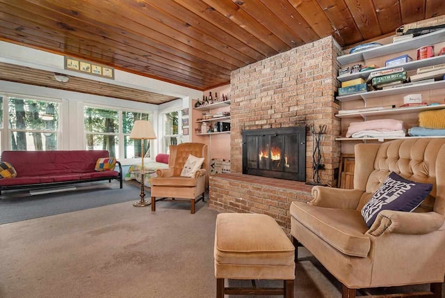 carpeted living room featuring wood ceiling and a brick fireplace