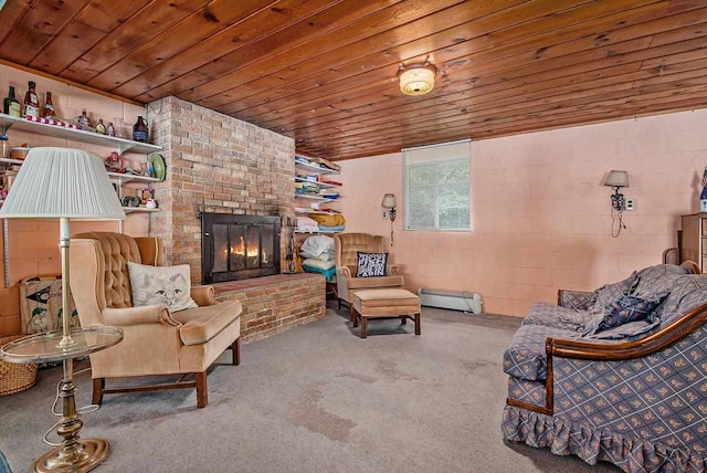 living room with a baseboard radiator, wood ceiling, a fireplace, and carpet floors