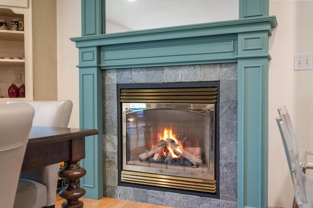 interior details with a tiled fireplace