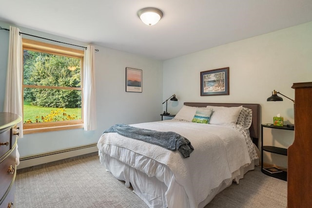 bedroom with carpet and baseboard heating