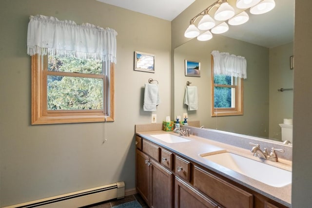 bathroom featuring vanity and baseboard heating