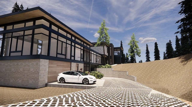 3087 Forrest Ave, Harbor Springs, MI 49740 - view of property exterior featuring decorative driveway and stone siding