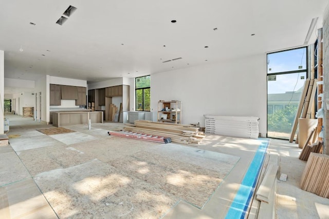 3087 Forrest Ave, Harbor Springs, MI 49740 - unfurnished living room with a wall of windows