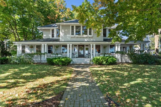 view of front facade with a front lawn and covered porch