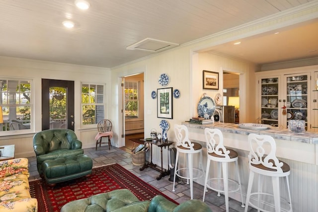 living room featuring crown molding