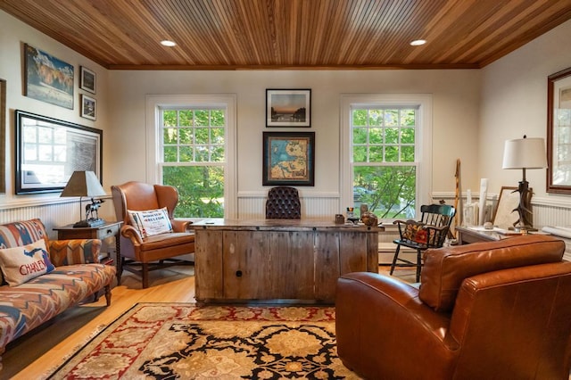 living room with wooden ceiling, light hardwood / wood-style floors, and a wealth of natural light