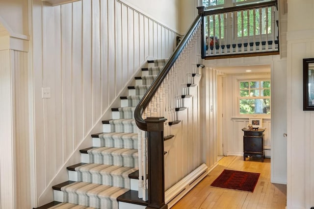 stairs featuring wood-type flooring