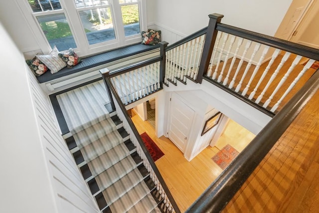 staircase with wood-type flooring