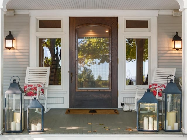 view of exterior entry featuring a porch