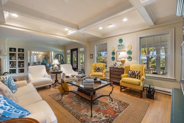 living room with hardwood / wood-style flooring, beamed ceiling, and plenty of natural light