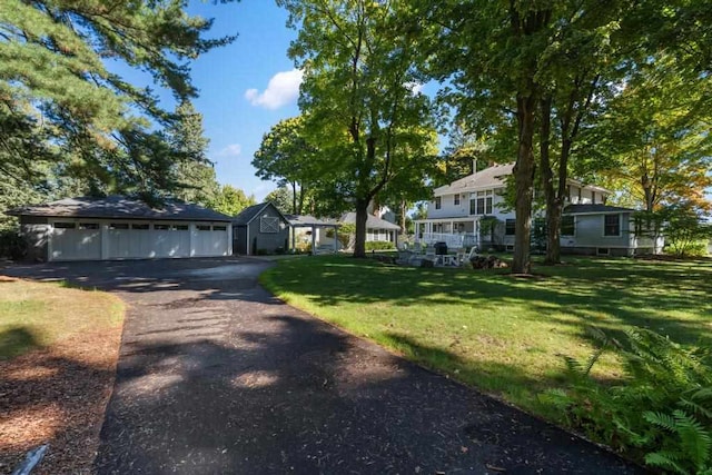 view of front facade featuring a garage and a front lawn