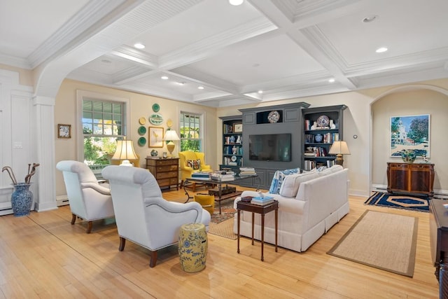 living room featuring coffered ceiling, beam ceiling, light hardwood / wood-style floors, and crown molding