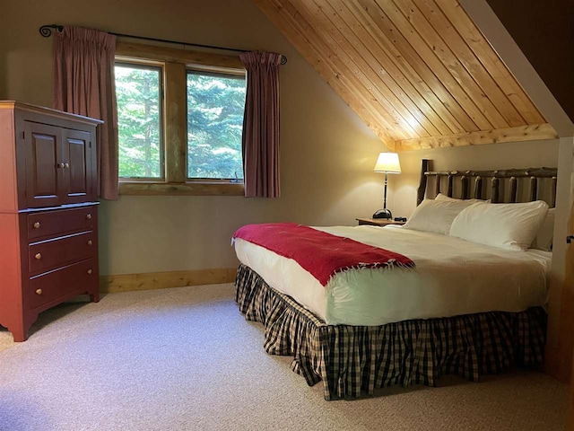 bedroom featuring lofted ceiling and carpet flooring