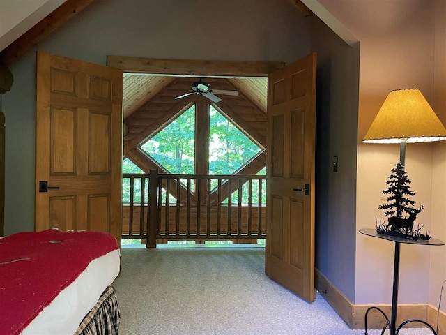 bedroom with vaulted ceiling with beams, wooden ceiling, and carpet flooring