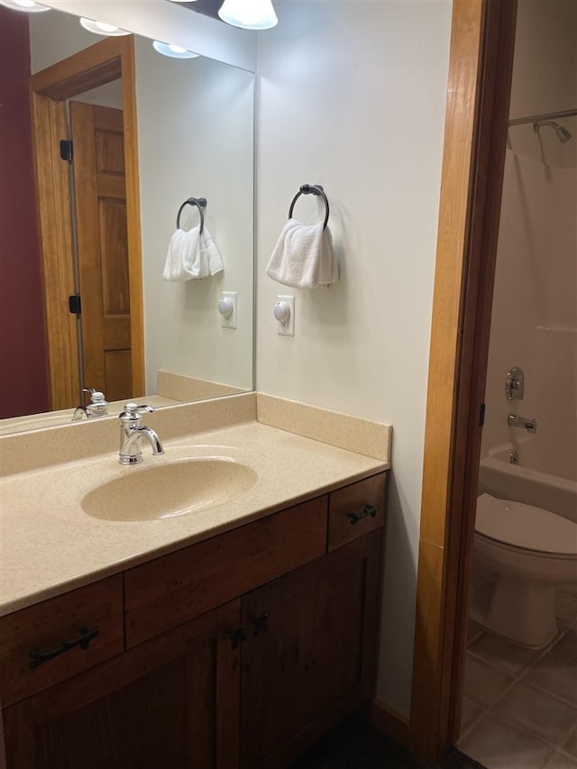 full bathroom featuring tile patterned floors,  shower combination, vanity, and toilet