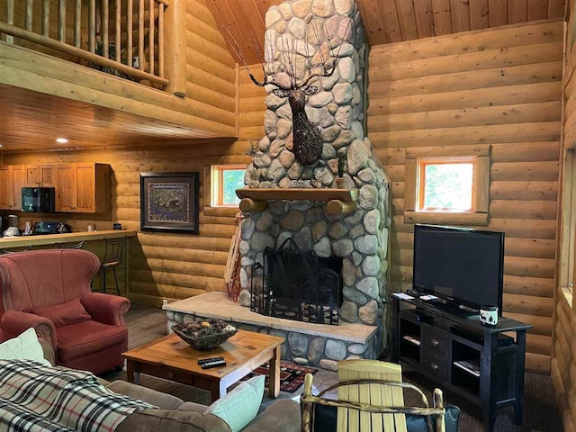 living room with high vaulted ceiling, rustic walls, wooden ceiling, and a fireplace