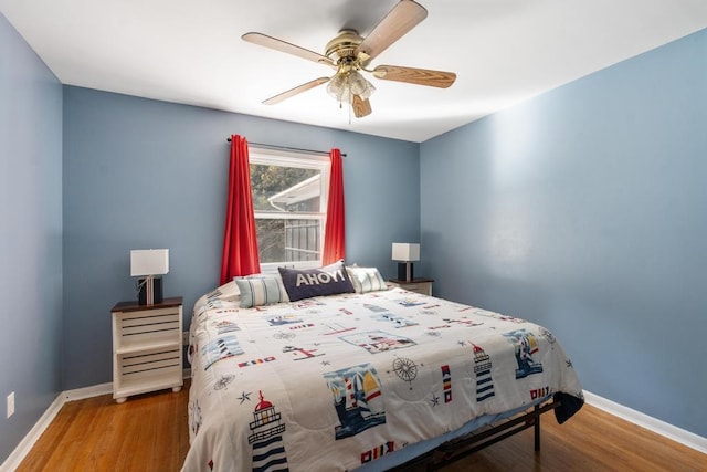 bedroom with wood-type flooring and ceiling fan