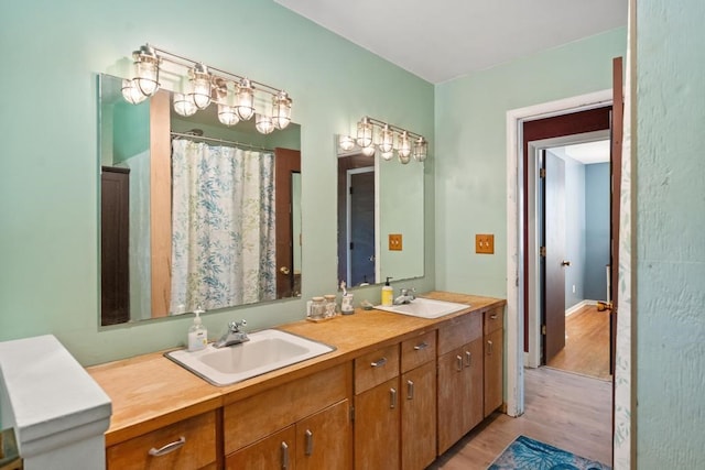 bathroom featuring vanity and hardwood / wood-style floors