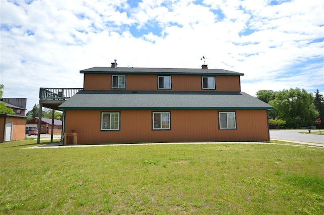 back of house with a yard