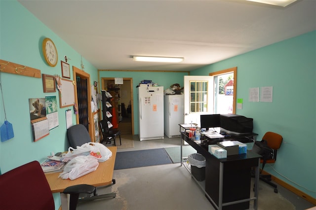 office area featuring concrete floors