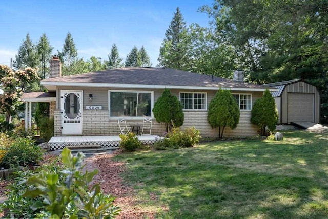 ranch-style house with a storage shed and a front yard