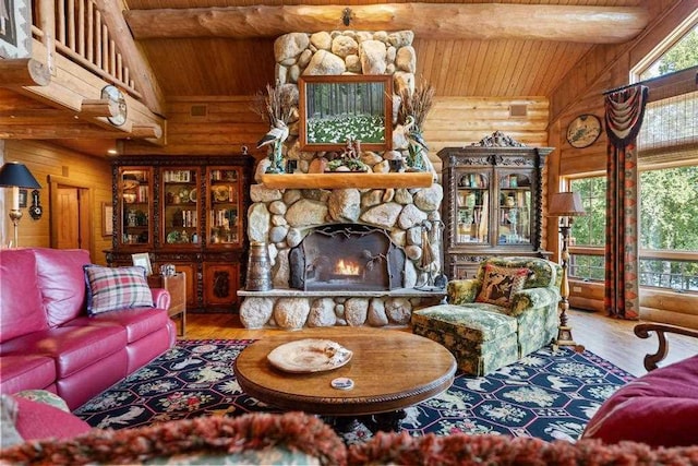 living room featuring a fireplace, wooden ceiling, vaulted ceiling with beams, wood finished floors, and log walls