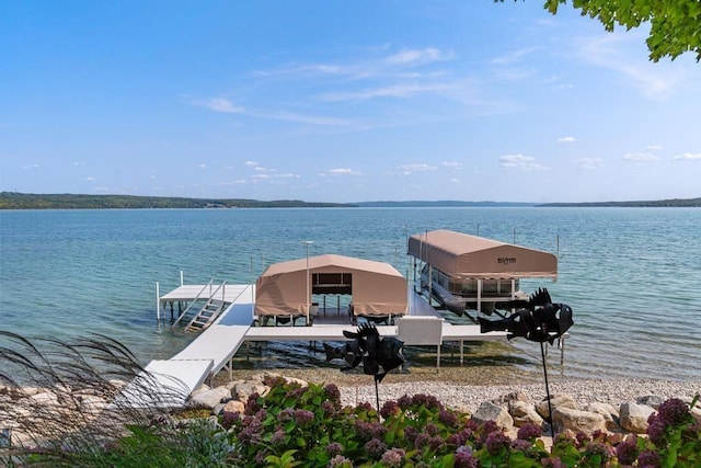 view of dock featuring boat lift and a water view