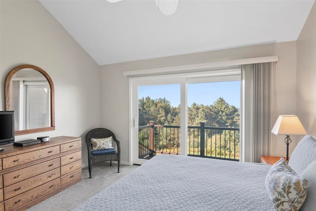 bedroom featuring light carpet, vaulted ceiling, and access to outside