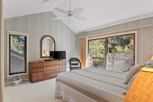 carpeted bedroom with vaulted ceiling and ceiling fan