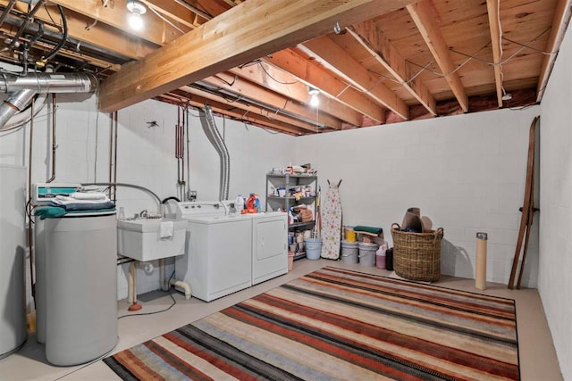 washroom with washer and clothes dryer and sink