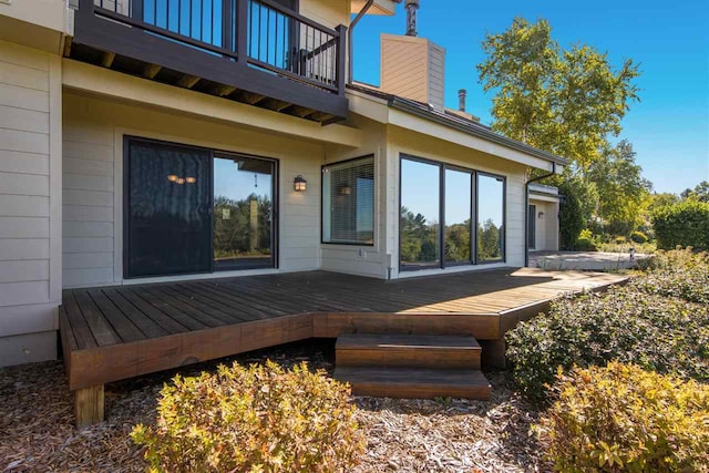 exterior space with a balcony and a deck