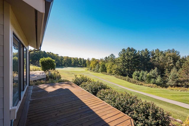 wooden terrace with a lawn