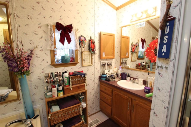 bathroom with vanity and crown molding