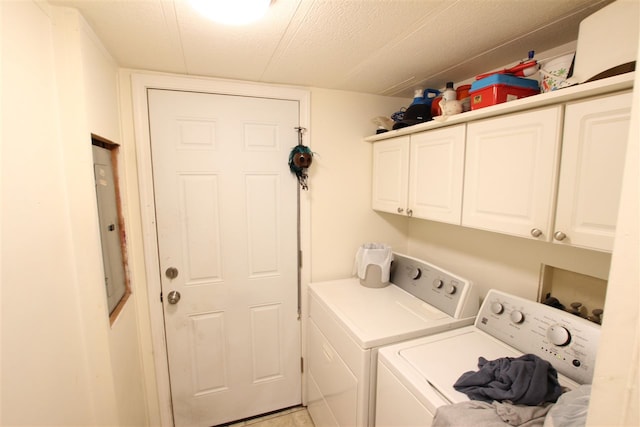 laundry room featuring cabinets, independent washer and dryer, and a textured ceiling