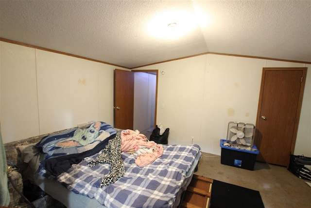 bedroom with a textured ceiling, carpet, lofted ceiling, and crown molding