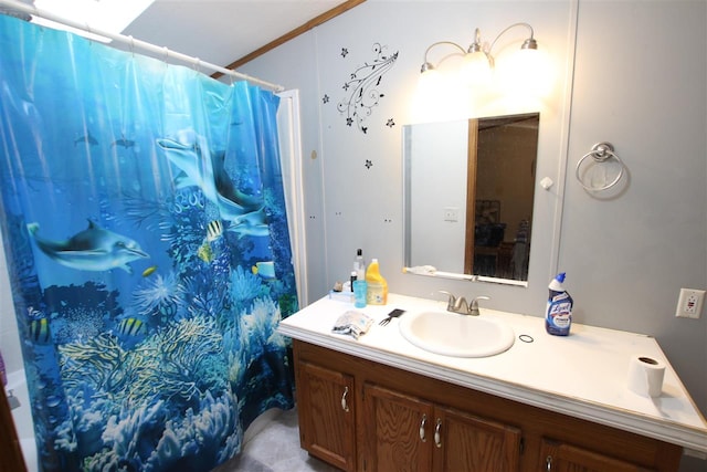 bathroom featuring vanity, crown molding, and curtained shower