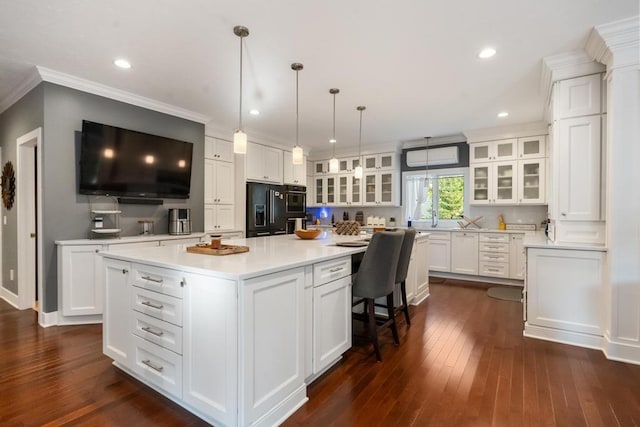 290 Mitchell Hills Dr, Petoskey, MI 49770 - kitchen featuring black refrigerator with ice dispenser, white cabinetry, light countertops, glass insert cabinets, and a kitchen island