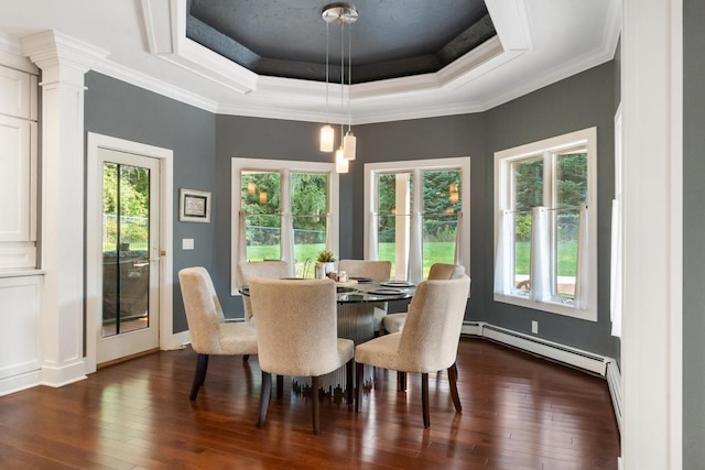 290 Mitchell Hills Dr, Petoskey, MI 49770 - dining space with baseboard heating, dark wood-style floors, a raised ceiling, ornamental molding, and baseboards