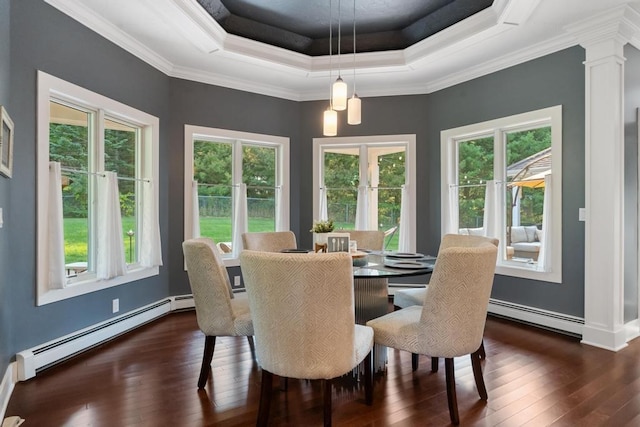 290 Mitchell Hills Dr, Petoskey, MI 49770 - dining area with a baseboard radiator, dark wood finished floors, healthy amount of natural light, decorative columns, and crown molding