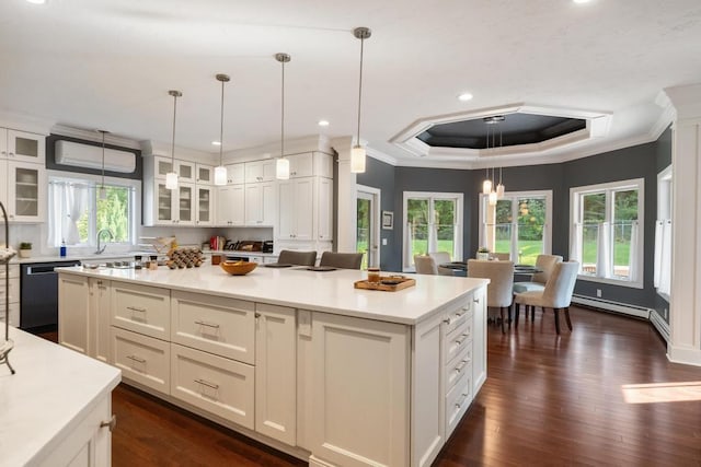 290 Mitchell Hills Dr, Petoskey, MI 49770 - kitchen with dishwasher, ornamental molding, dark wood finished floors, plenty of natural light, and light countertops