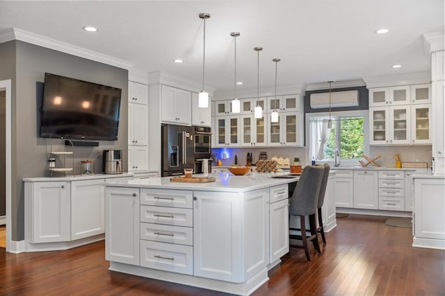 290 Mitchell Hills Dr, Petoskey, MI 49770 - kitchen featuring fridge with ice dispenser, dark wood-style floors, white cabinetry, light countertops, and ornamental molding