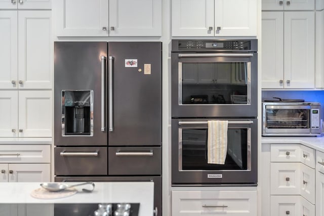 290 Mitchell Hills Dr, Petoskey, MI 49770 - kitchen featuring appliances with stainless steel finishes, white cabinetry, and light countertops
