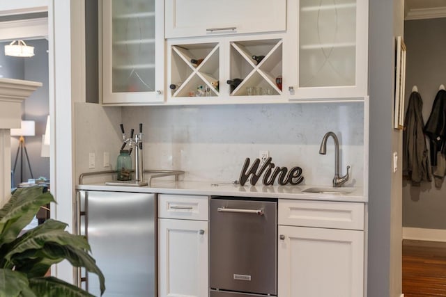 290 Mitchell Hills Dr, Petoskey, MI 49770 - bar area with a sink, decorative backsplash, wood finished floors, and stainless steel refrigerator