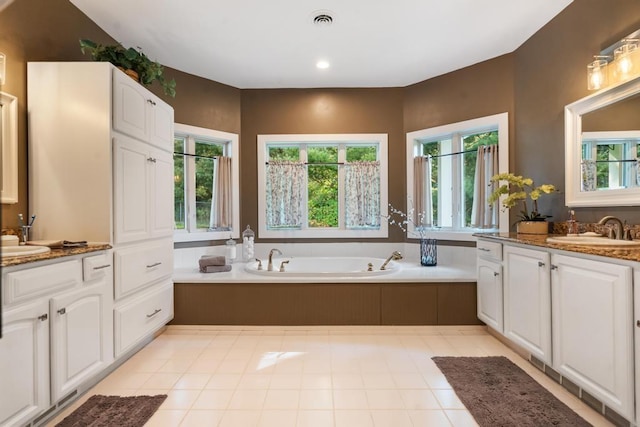290 Mitchell Hills Dr, Petoskey, MI 49770 - full bathroom with two vanities, a garden tub, recessed lighting, and tile patterned flooring