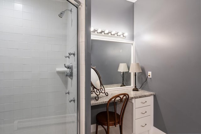 290 Mitchell Hills Dr, Petoskey, MI 49770 - bathroom with a tile shower and vanity