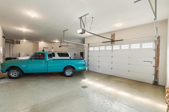290 Mitchell Hills Dr, Petoskey, MI 49770 - garage featuring a garage door opener