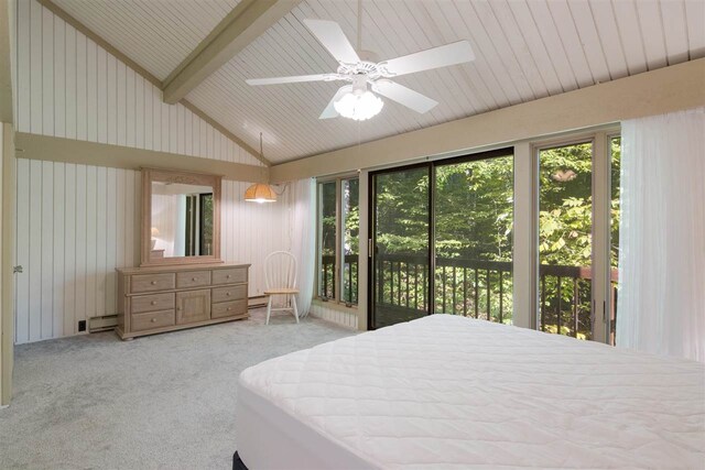 2500 Josef Strasse Unit 410/411, Bellaire, MI 49615 - bedroom with access to outside, lofted ceiling with beams, multiple windows, and carpet