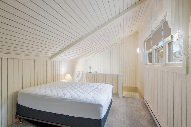 carpeted bedroom featuring wood ceiling, wood walls, a baseboard radiator, radiator, and vaulted ceiling with beams