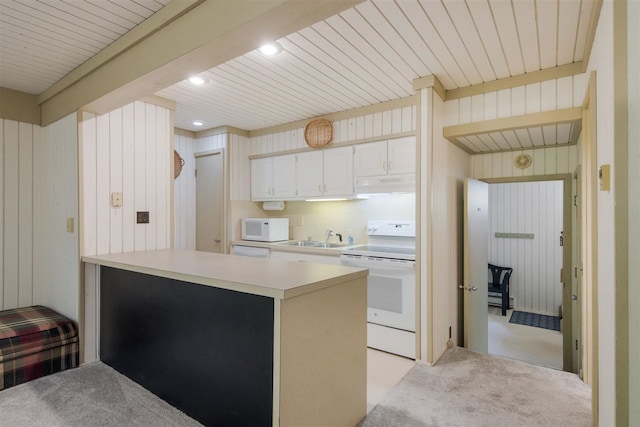 kitchen with white cabinetry, white appliances, kitchen peninsula, sink, and light carpet