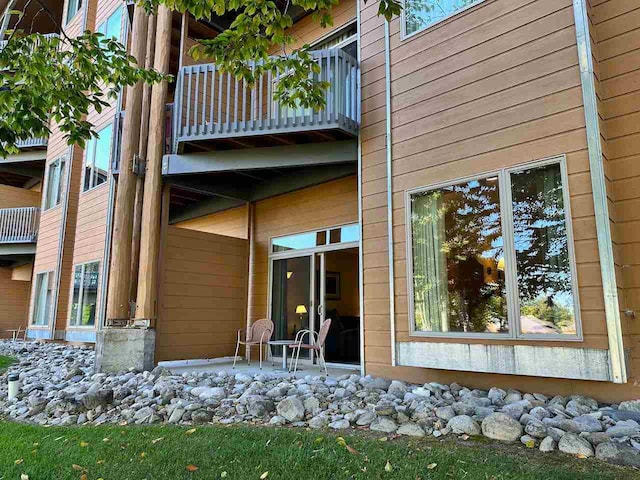 view of side of home with a balcony